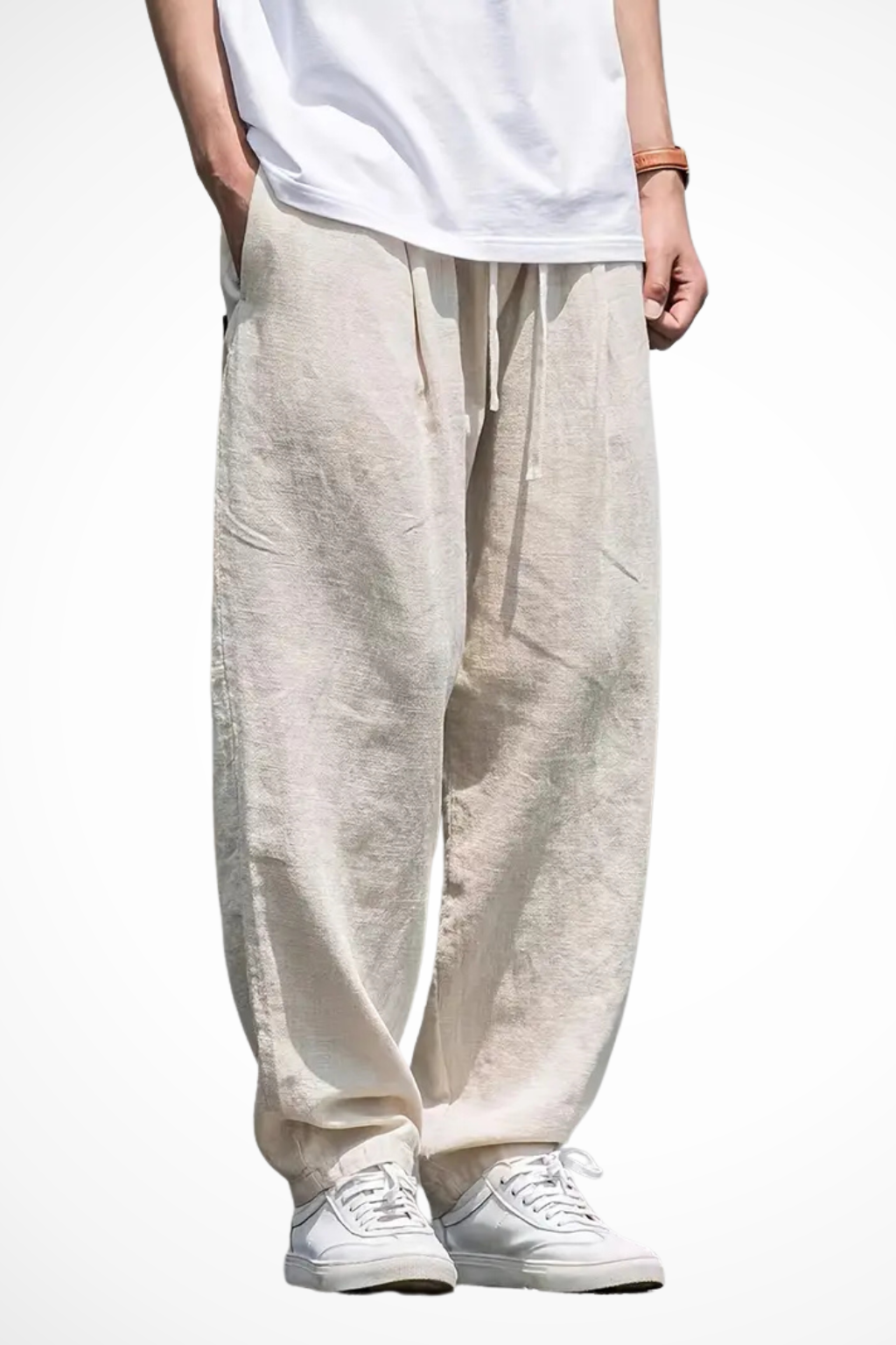 Men's wide leg trousers with elastic waist & front pockets in a relaxed fit. Ideal for casual fashion.