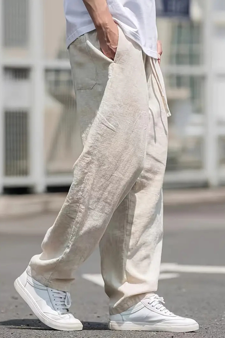 Men's straight wide leg trousers, elastic waist, front pockets. Versatile casual drawstring pants.