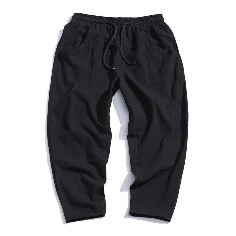 Modern cropped hem of men's relaxed fit chinos, a stylish detail for comfortable casual summer outfits.
