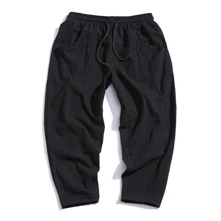 Modern cropped hem of men's relaxed fit chinos, a stylish detail for comfortable casual summer outfits.