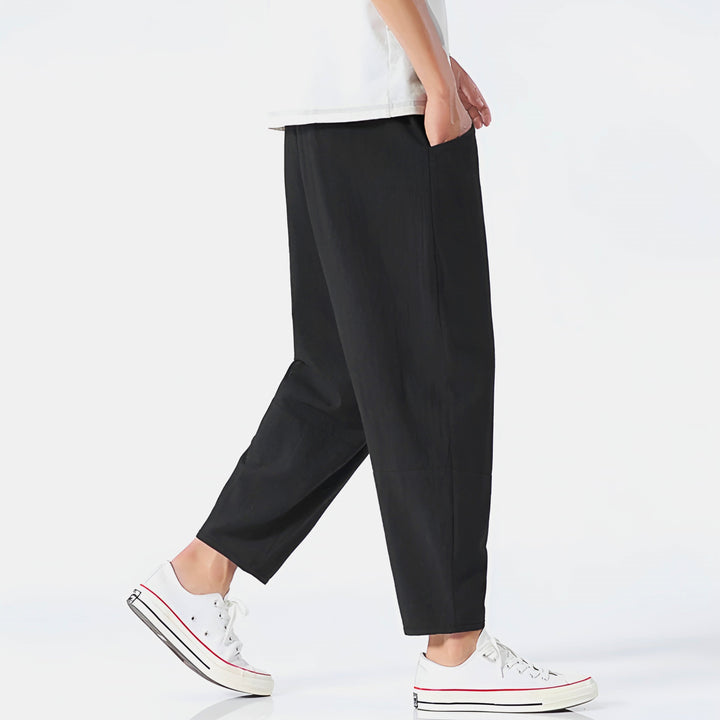 Drawstring waistband detail on men's relaxed fit cropped chinos, ensuring maximum comfort for casual everyday.