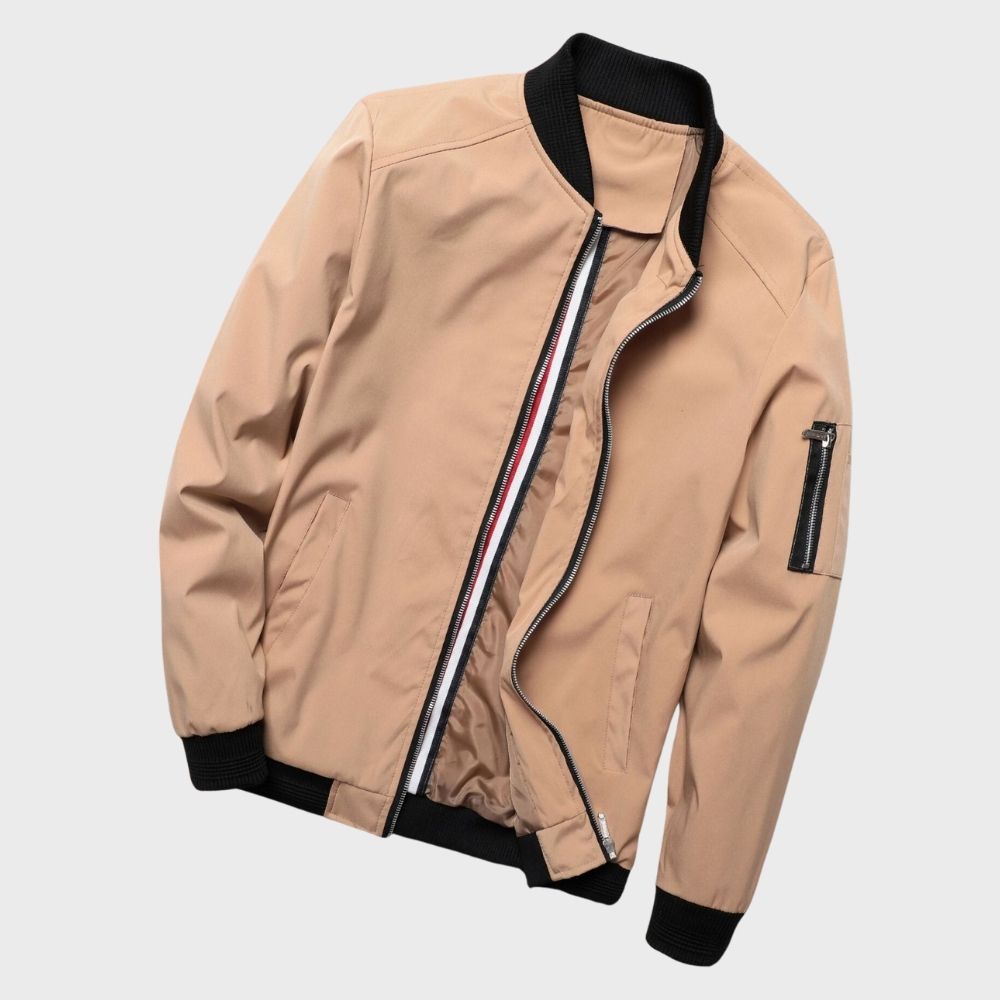 "Men's blue bomber jacket with zipper pockets, stylish fit, lightweight fabric, perfect for cool evenings."