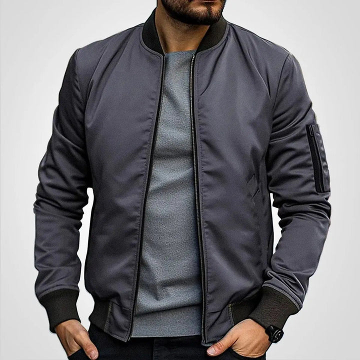 Timeless men's zip-up bomber flight jacket, featuring a classic ribbed collar. Essential casual outerwear.