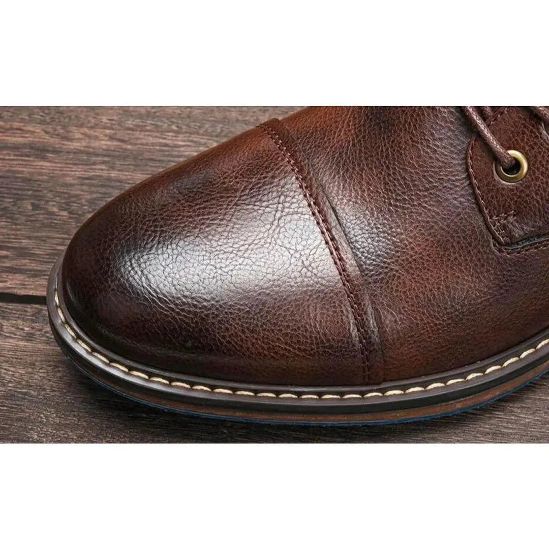 Stylish cap toe men's oxford ankle boots in genuine leather, perfect for modern men's fashion footwear.