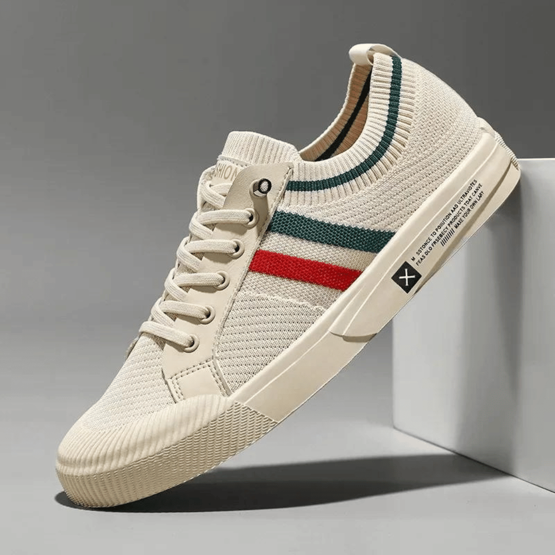 "Men’s casual sneakers in breathable knit fabric, lace-up design with durable rubber sole, perfect for everyday comfort."