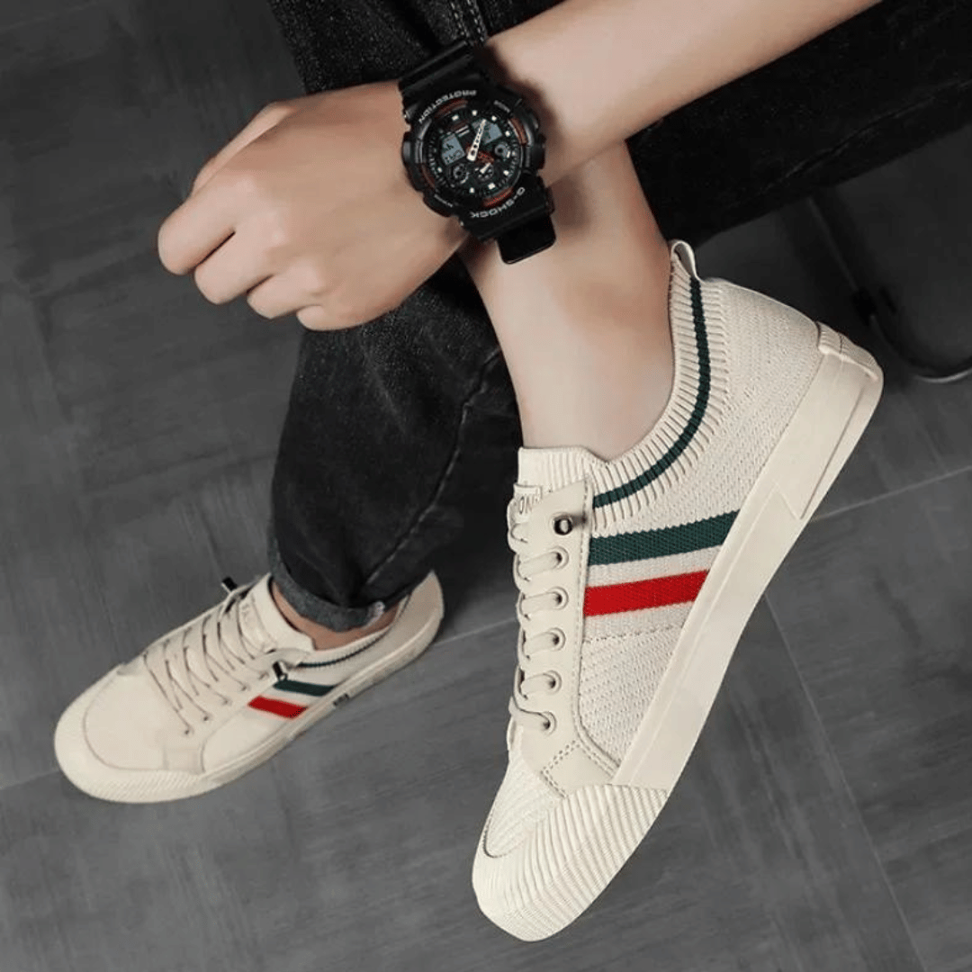 "Men’s casual sneakers in breathable knit fabric, lace-up design with durable rubber sole, perfect for everyday comfort."