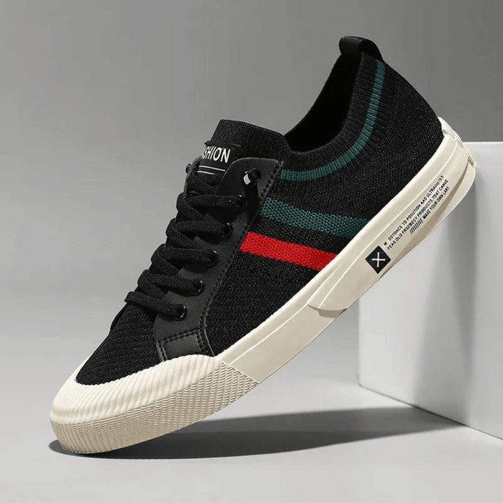 "Men’s casual sneakers in breathable knit fabric, lace-up design with durable rubber sole, perfect for everyday comfort."