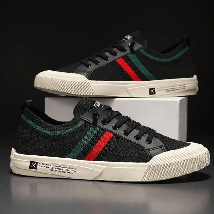 "Men’s casual sneakers in breathable knit fabric, lace-up design with durable rubber sole, perfect for everyday comfort."