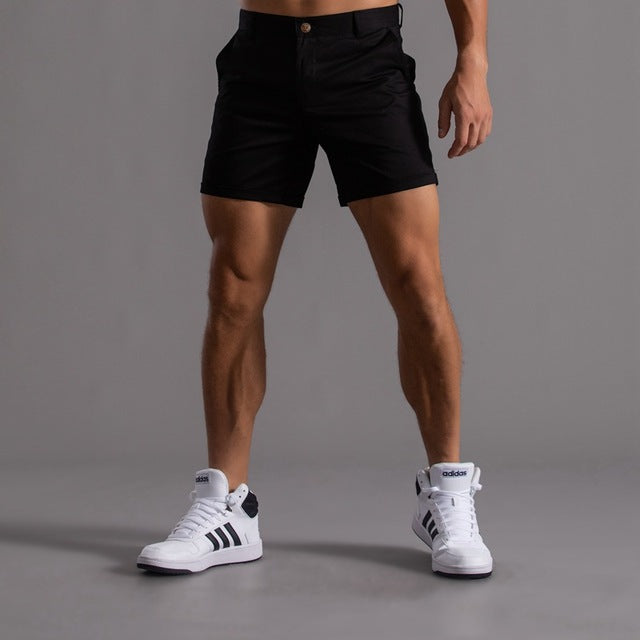 Men's cotton knee-length chino shorts in khaki, featuring a classic summer design and breathable material, ideal for casual w