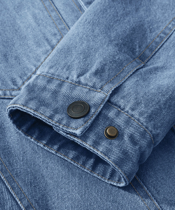 Men's denim wanderer jacket, flannel-lined, brown color, dual chest pockets, button-front closure, rugged and stylish.