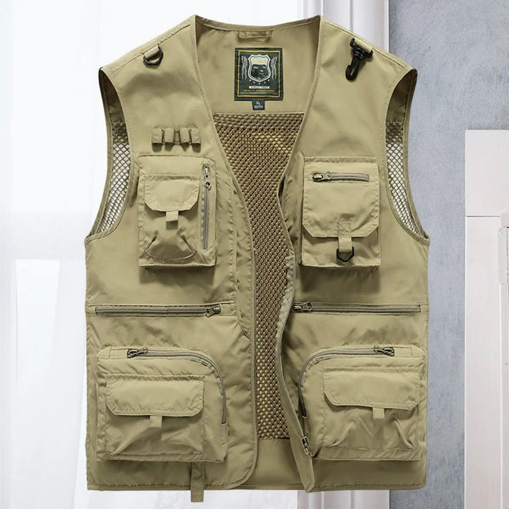 Hiker on a trail, equipped with a versatile multi-pocket outdoor vest, ideal for storing essentials.