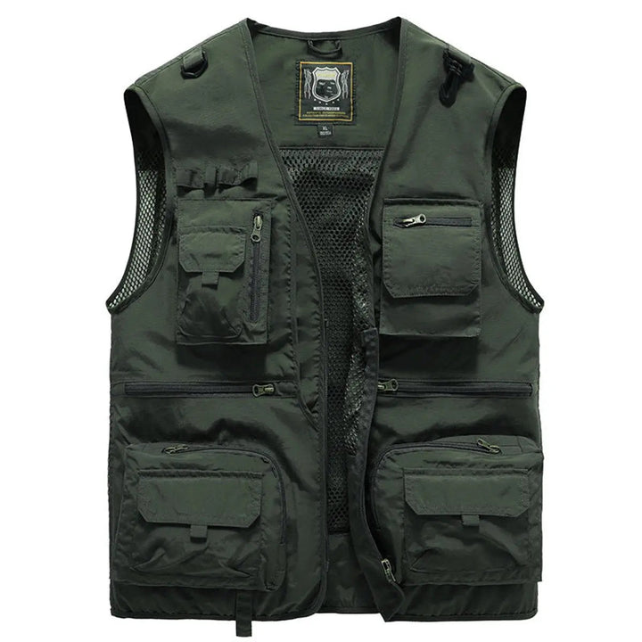 Man wearing a versatile multi-pocket fishing vest while hiking, perfect for outdoor travel & camping.