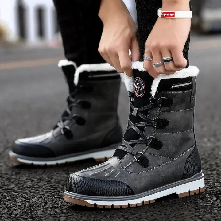 Men's mid-calf waterproof insulated snow boots with brown synthetic exterior and plush lining for winter warmth and protectio