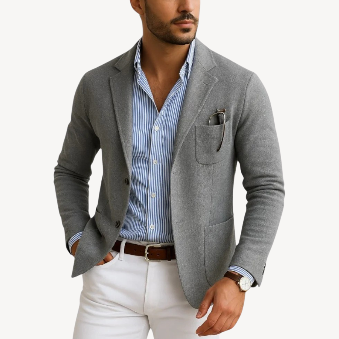 "Men's navy slim fit cotton blend blazer with notched lapel shown front view, perfect for casual and smart occasions."