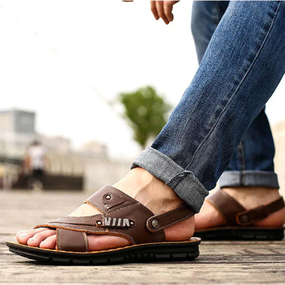 Men's open-toe leather sandals with cushioned sole, adjustable straps, and premium finish for casual summer wear.
