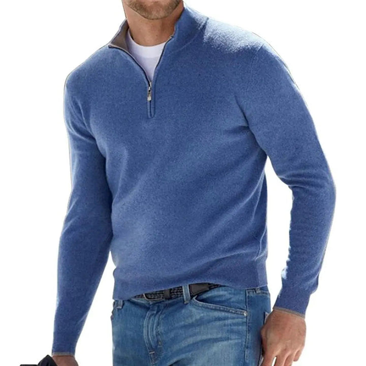 Close-up of a men's ribbed quarter-zip sweater, highlighting the knit texture and zip detail.