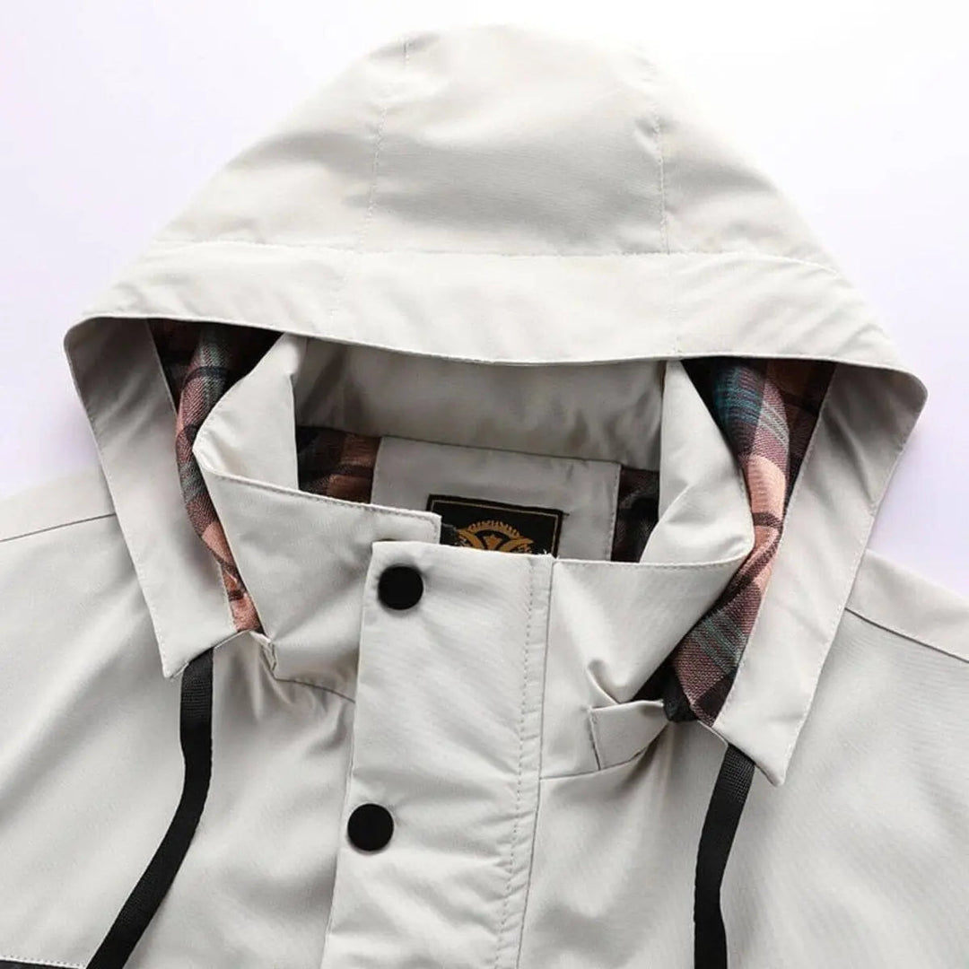 Durable men's outdoor quilted jacket, hooded, windproof & waterproof for hiking & cold weather.