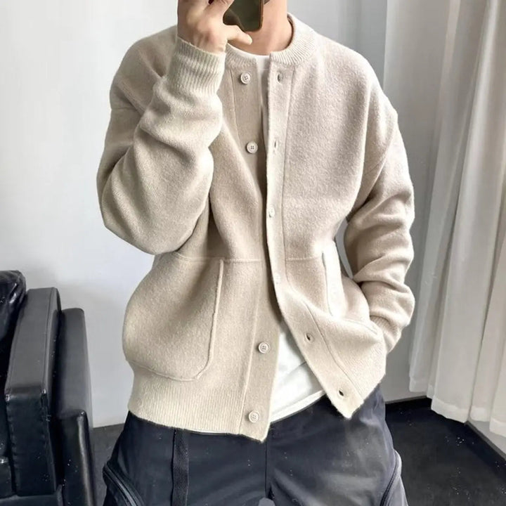 Comfortable men's relaxed fit knit cardigan, perfect for casual layering. Effortless button-up design.