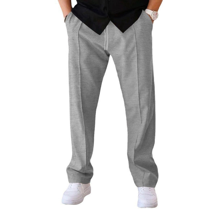 "Men's relaxed linen trousers, wide-leg, breathable, versatile colors like beige, black, blue; perfect comfort and style"
