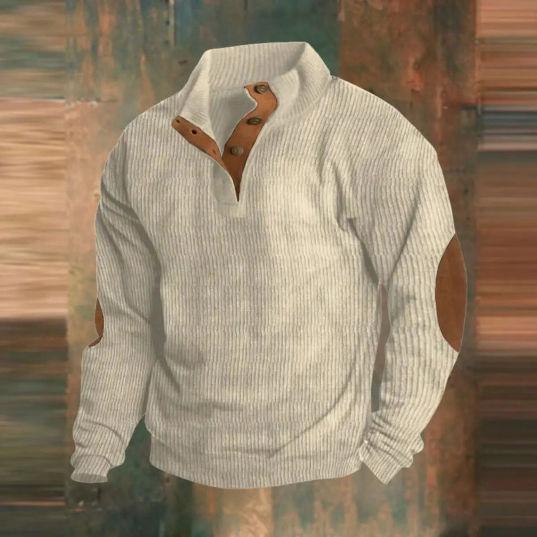 Cozy men's ribbed knit quarter-snap pullover sweater with elbow patches. Ideal retro style for layered fall fashion.
