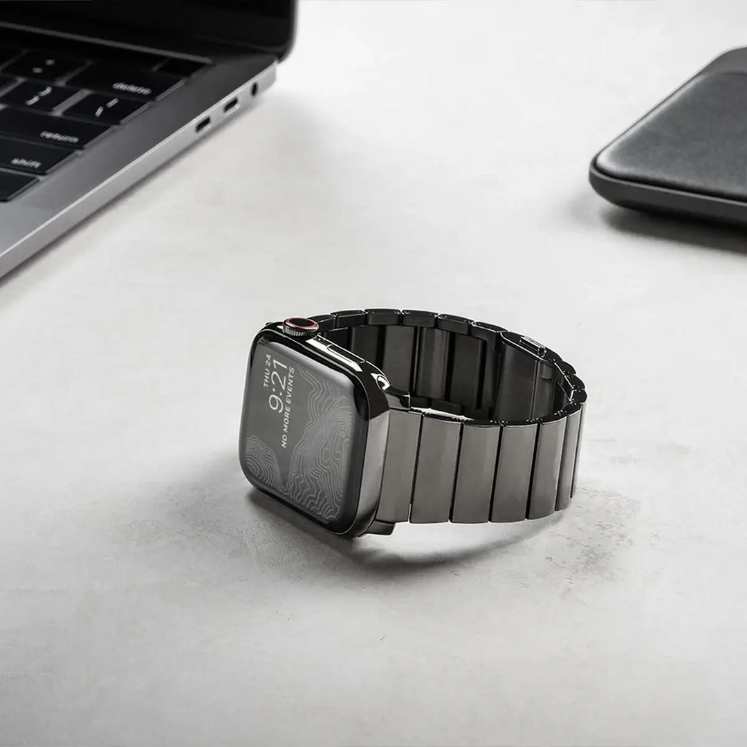 Men's sleek titanium watch band with shiny finish, magnetic clasp, durable and lightweight; perfect for daily or formal wear.