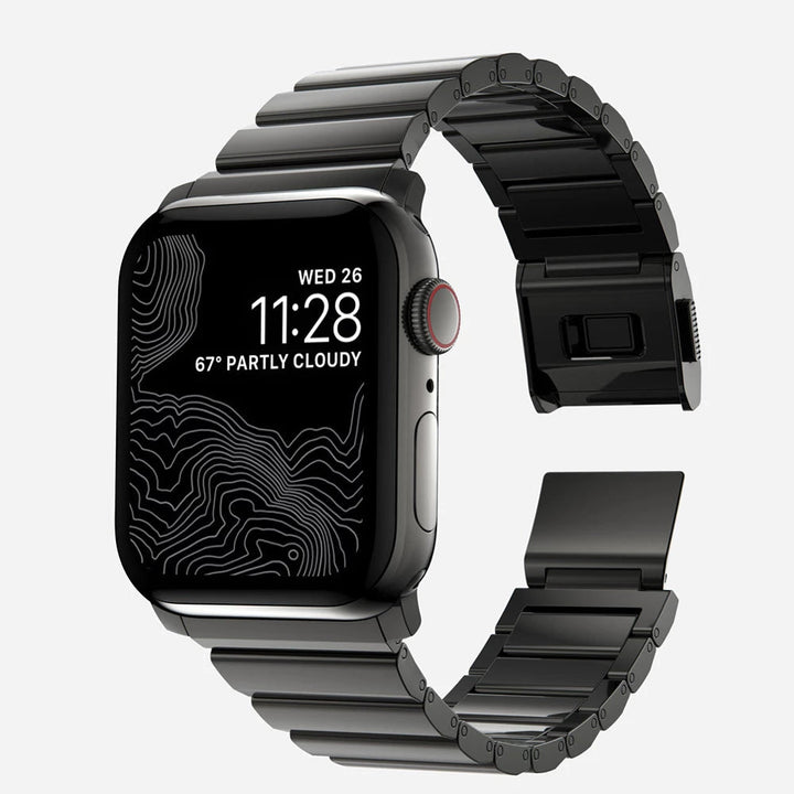 Men's sleek titanium watch band with shiny finish, magnetic clasp, durable and lightweight; perfect for daily or formal wear.