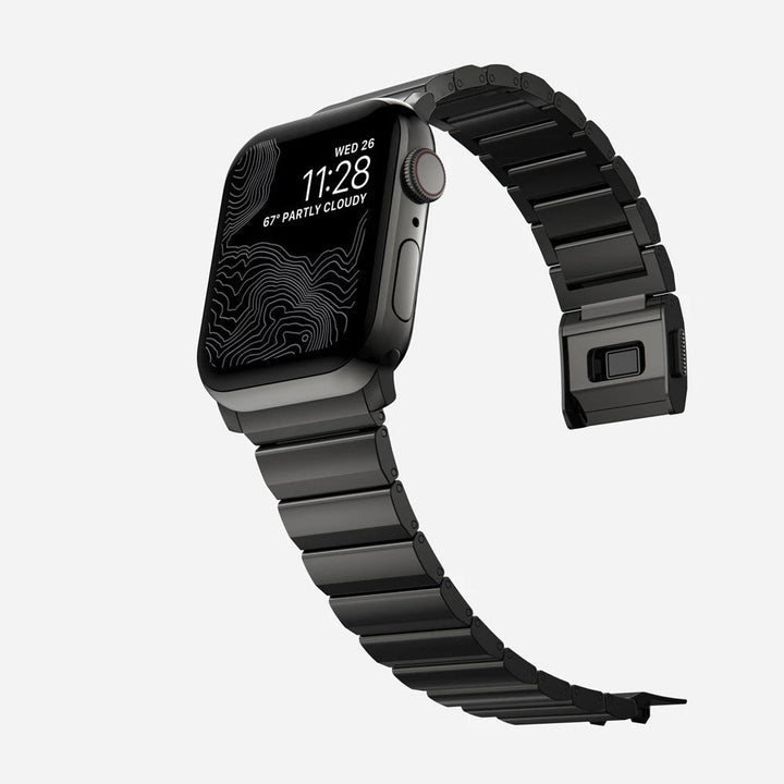Men's sleek titanium watch band with shiny finish, magnetic clasp, durable and lightweight; perfect for daily or formal wear.