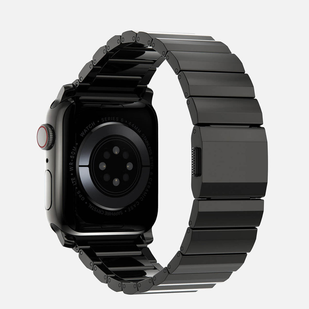 Men's sleek titanium watch band with shiny finish, magnetic clasp, durable and lightweight; perfect for daily or formal wear.