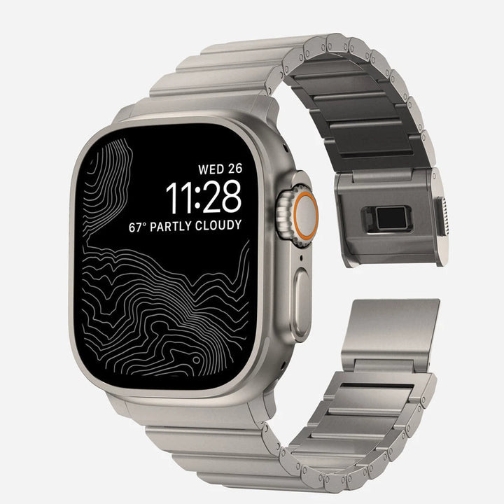 Men's sleek titanium watch band with shiny finish, magnetic clasp, durable and lightweight; perfect for daily or formal wear.