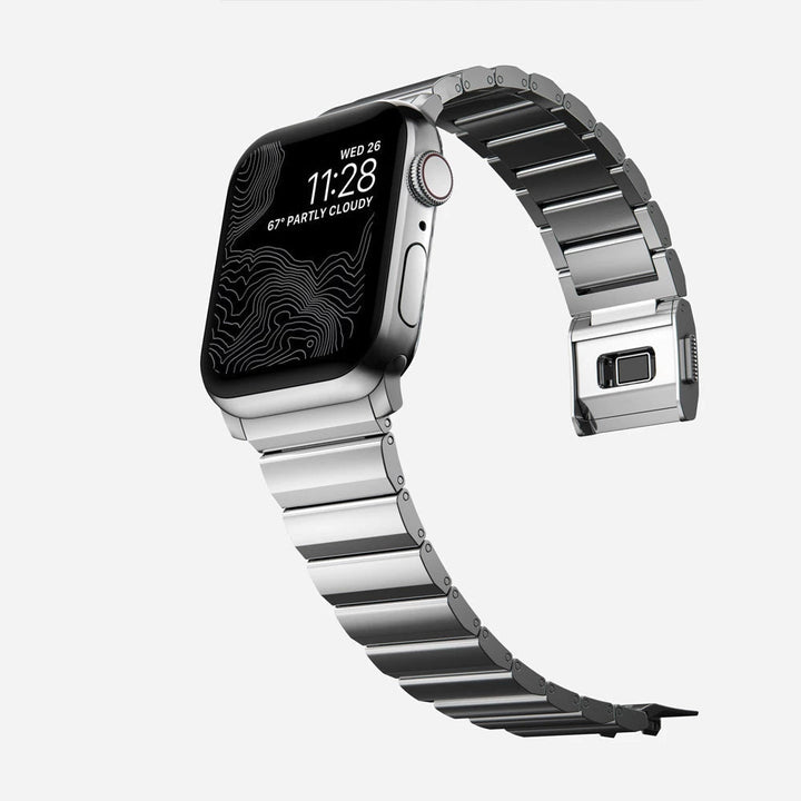 Men's sleek titanium watch band with shiny finish, magnetic clasp, durable and lightweight; perfect for daily or formal wear.