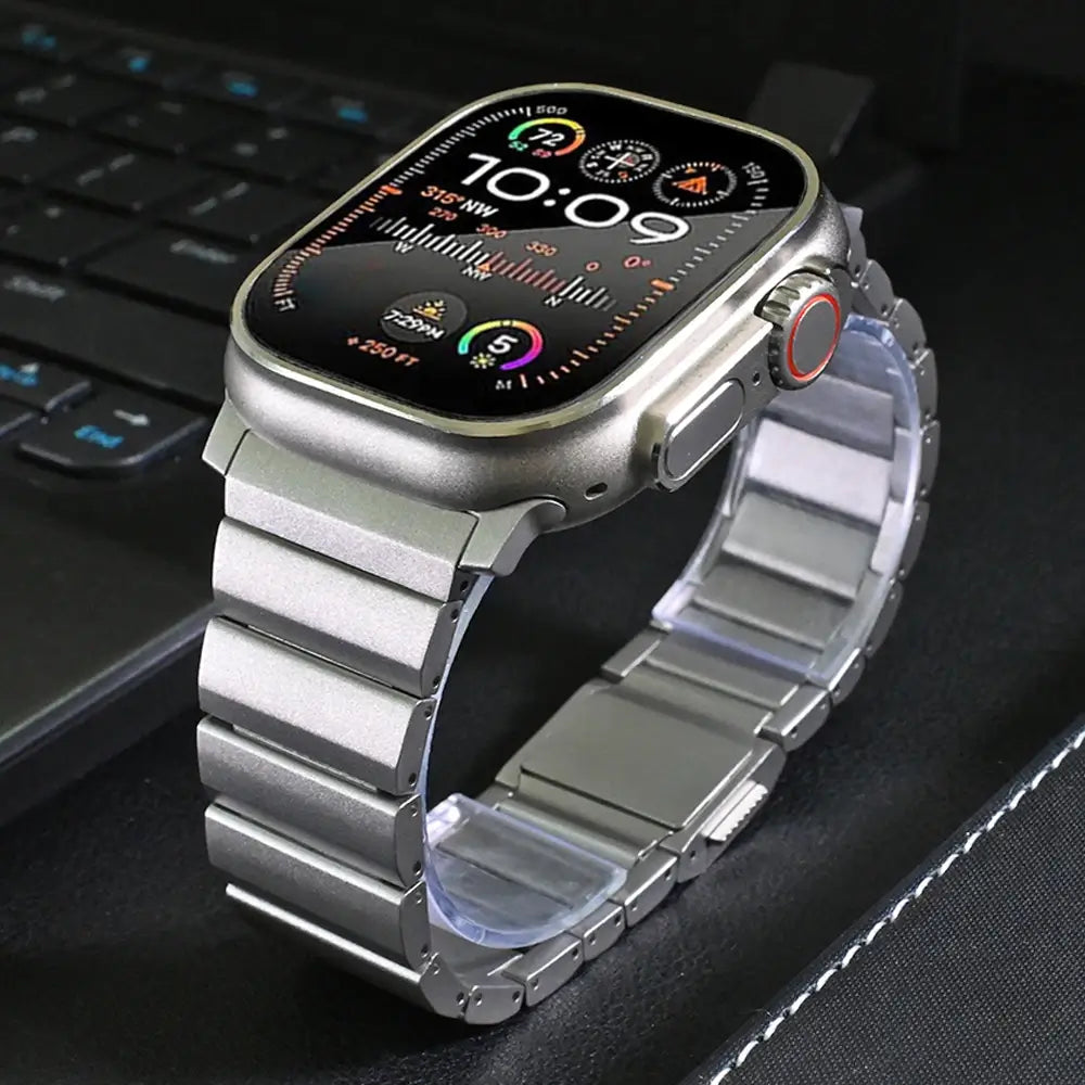 Men's sleek titanium watch band with shiny finish, magnetic clasp, durable and lightweight; perfect for daily or formal wear.