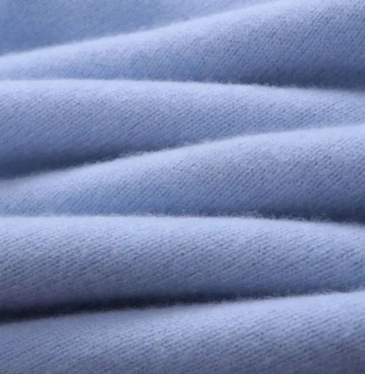Textured mohair blend men's knit sweater, a classic crew neck pullover offering warmth and style for winter.
