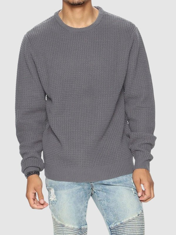 Model wearing a stylish, comfortable men's oversized crew neck waffle knit sweater.