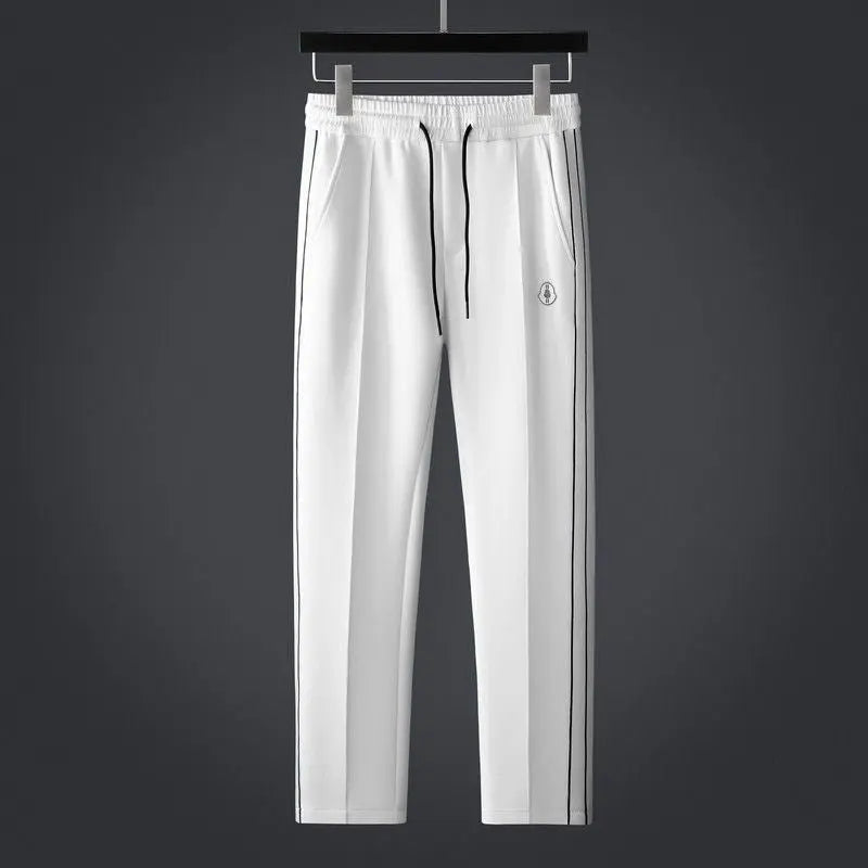 Versatile men's athletic tracksuit, two-piece set with zip jacket & comfortable joggers.