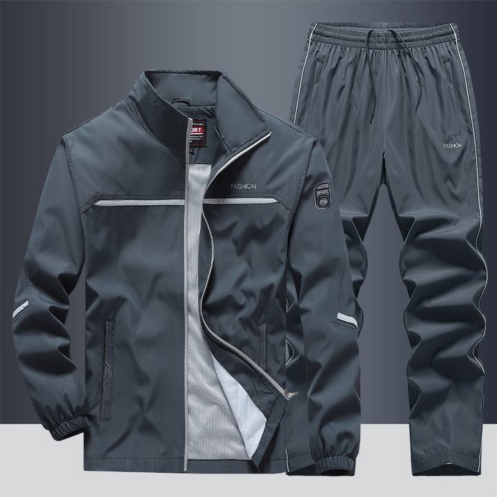 "Men's two-piece striped tracksuit with zip jacket and drawstring joggers, bold stripe design, comfortable fabric."