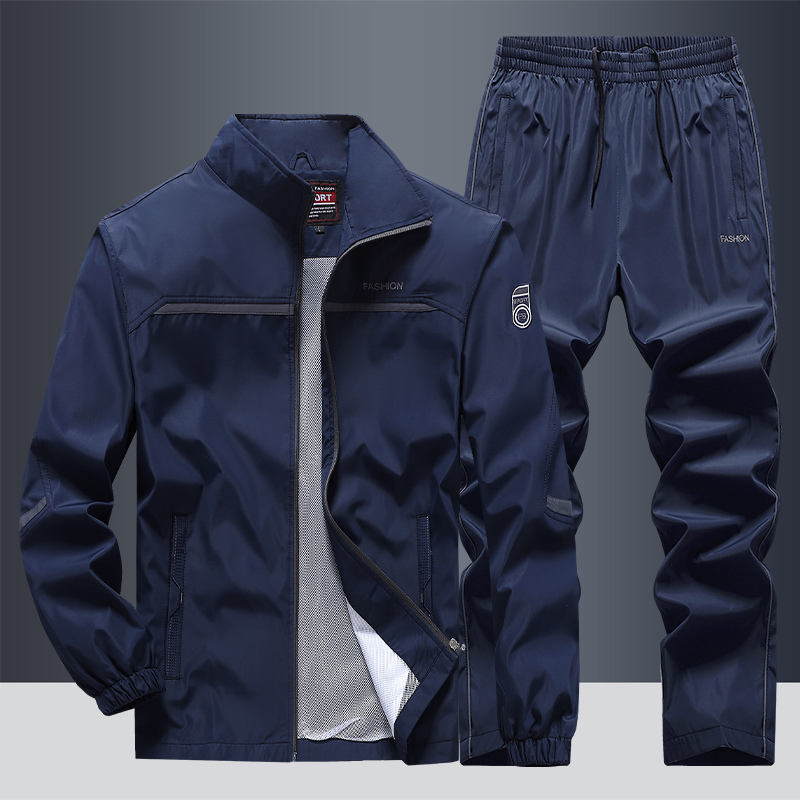 "Men's two-piece striped tracksuit with zip jacket and drawstring joggers, bold stripe design, comfortable fabric."