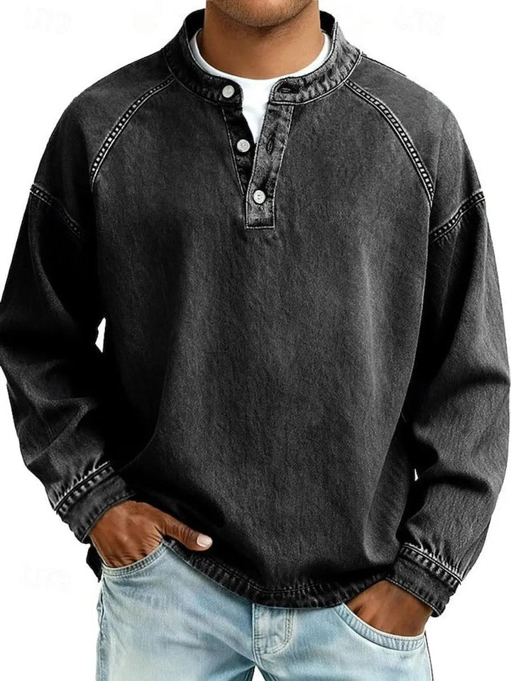 Black men's retro Henley long sleeve pullover shirt with raglan sleeves. Casual vintage style top for daily wear.
