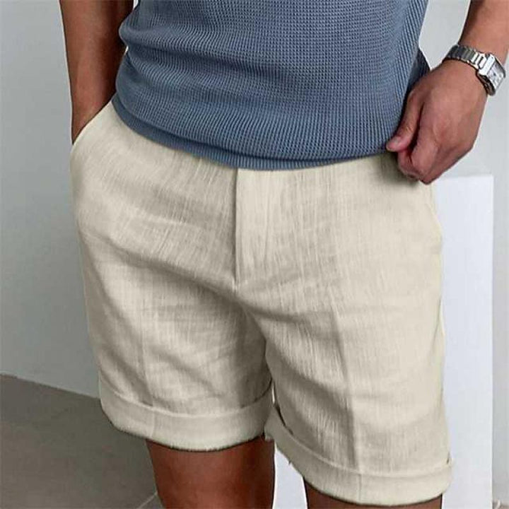 Men's vintage linen beach shorts, breathable and stylish in neutral tones, ideal for summer comfort and casual wear.