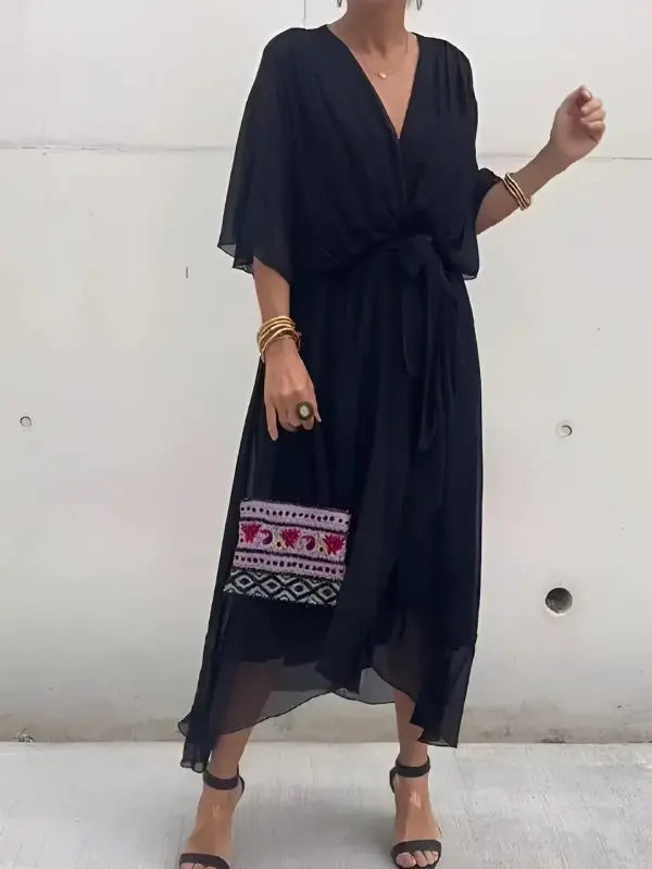 Sophisticated V-neck wrap midi dress for women, ideal as occasion wear with elegant flowing sleeves.