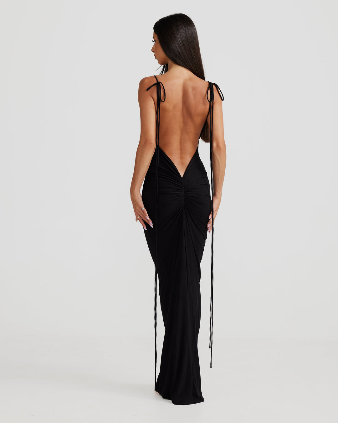 Sophisticated women's elegant maxi dress, backless design with delicate pleats, long formal wear.