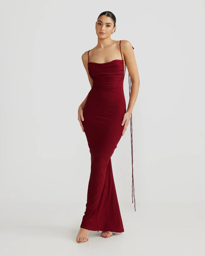 Sophisticated women's party dress: pleated backless maxi with a flowing silhouette, formal evening wear.