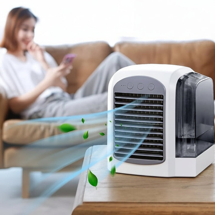 Rechargeable mini evaporative air cooler fan with oscillation for personal desk cooling.