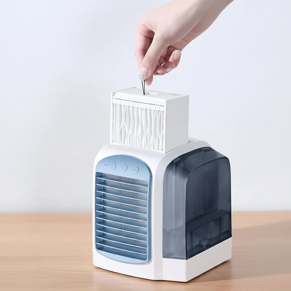 Small portable oscillating air cooler fan, ideal for personal space, office, or bedside table.