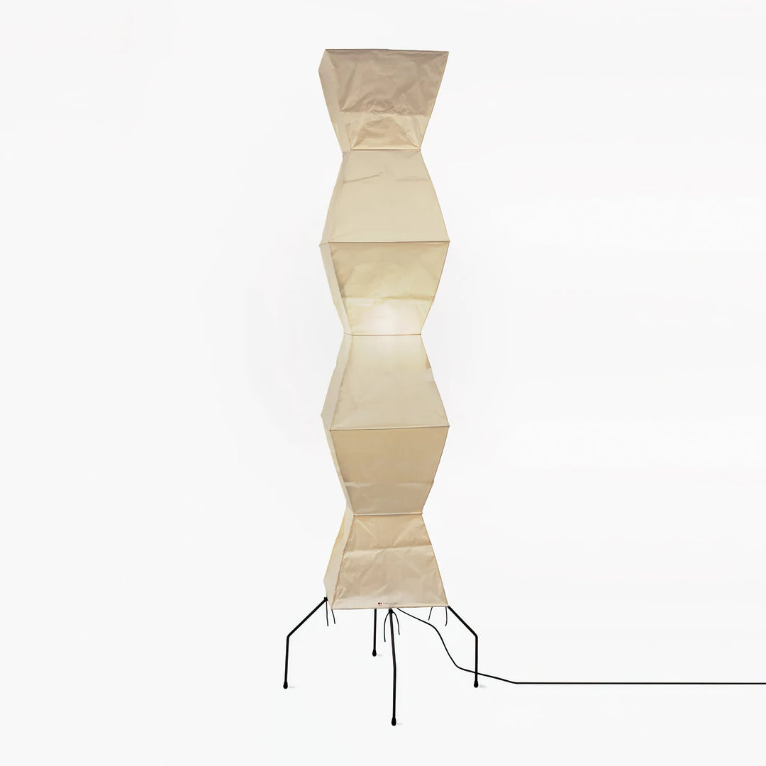 "Minimalist rice paper floor lamp with sleek metal frame and soft diffused light, perfect for creating a warm ambiance."