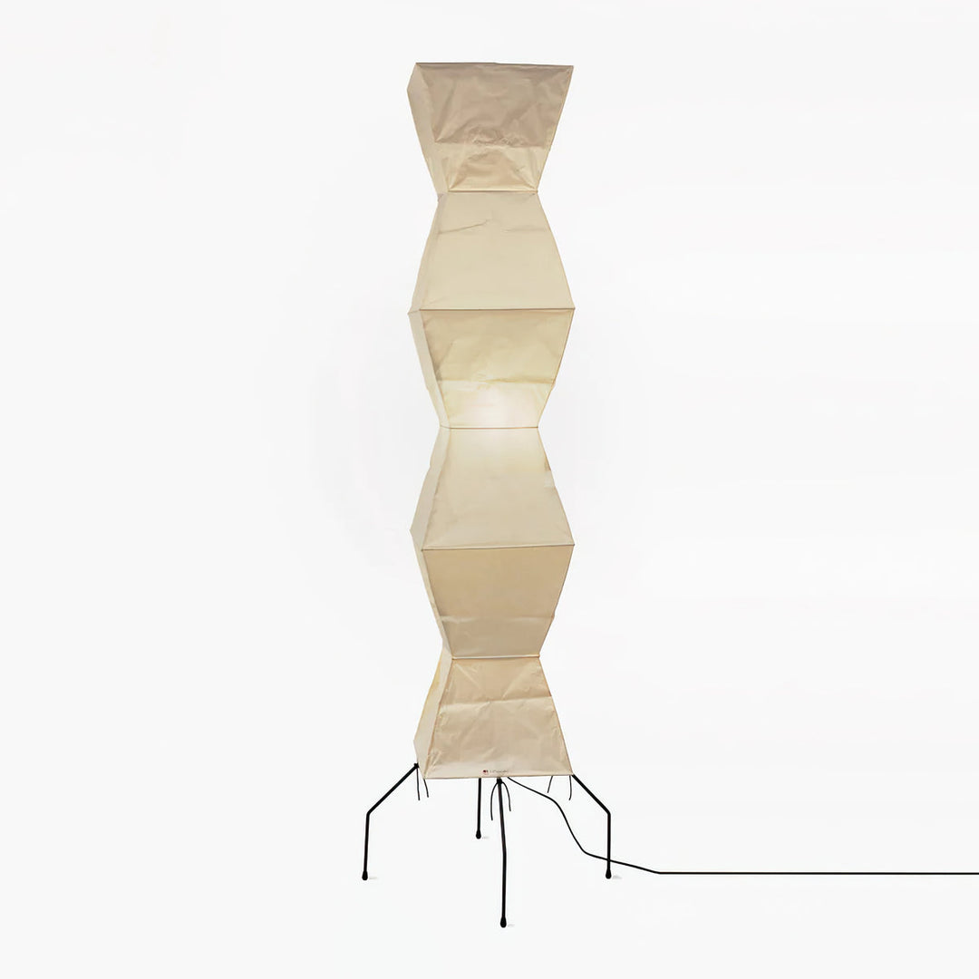 "Minimalist rice paper floor lamp with sleek metal frame and soft diffused light, perfect for creating a warm ambiance."