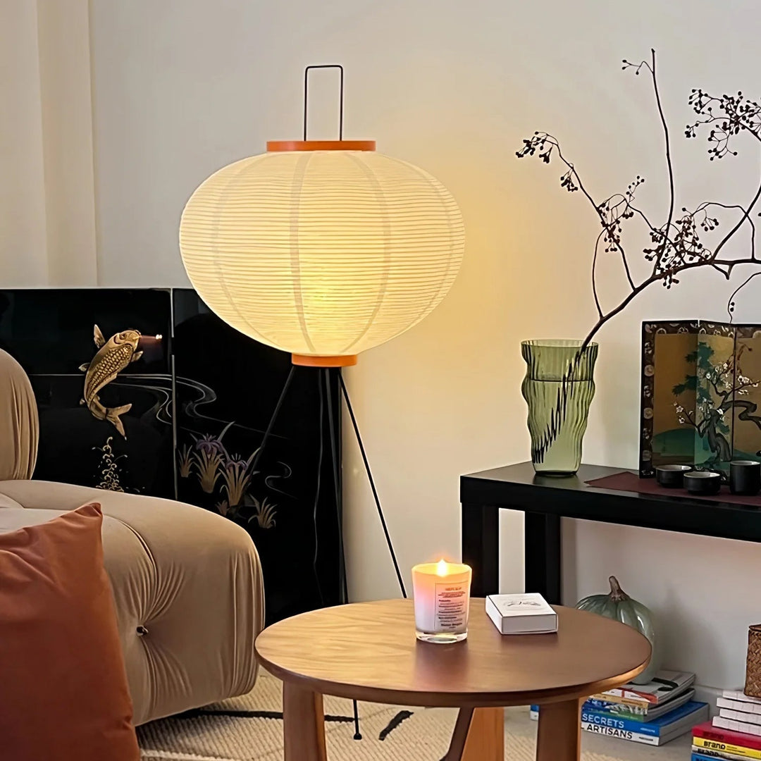 "Minimalist rice paper floor lamp with sleek metal frame and soft diffused light, perfect for creating a warm ambiance."