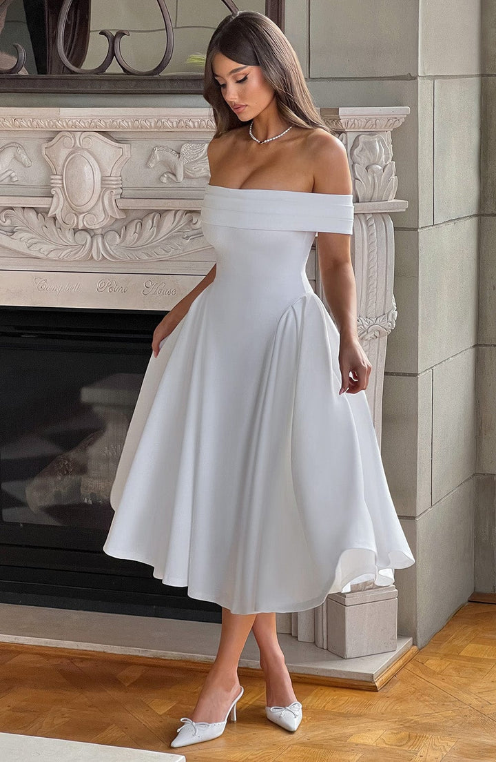 Elegant off-shoulder pleated midi dress for women, perfect as a wedding guest or party dress. Stylish special occasion wear.