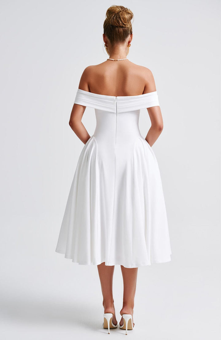 Stylish women's pleated off-shoulder midi dress. Versatile elegant attire for wedding guests, parties, and evening events.