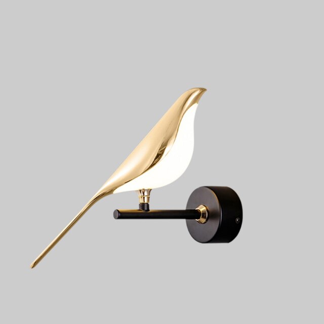 Modern bird-shaped wall lamp with magnetic attachment, featuring sleek LED lighting and elegant design for stylish interiors.
