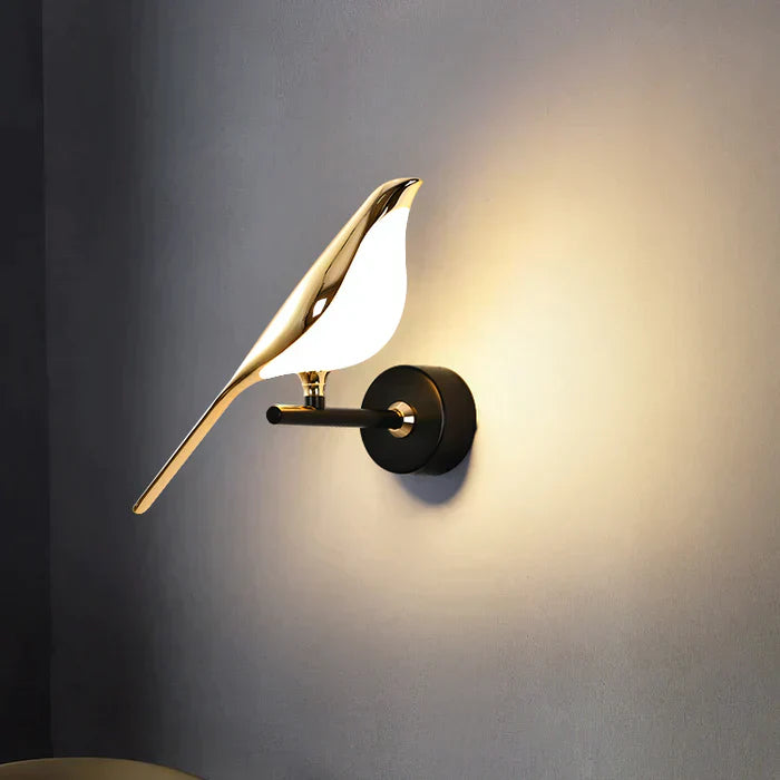 Modern bird-shaped wall lamp with magnetic attachment, featuring sleek LED lighting and elegant design for stylish interiors.